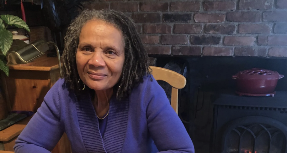 Photo: Beverly Braxton in a blue sweater sitting at a table