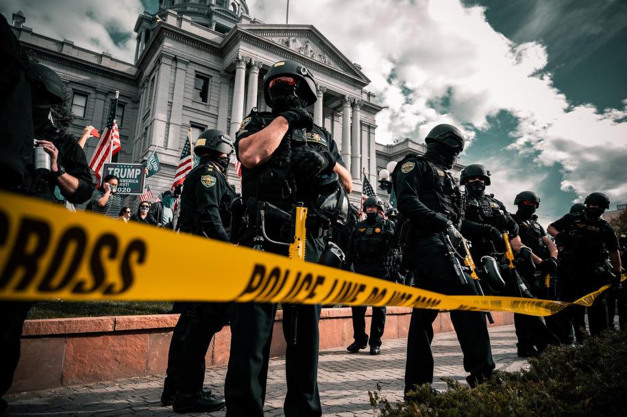 Photo of police at protest by Colin Lloyd via Unsplash