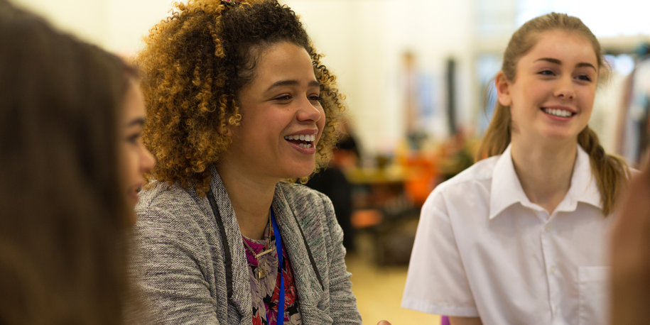 Stock photo of three students talking