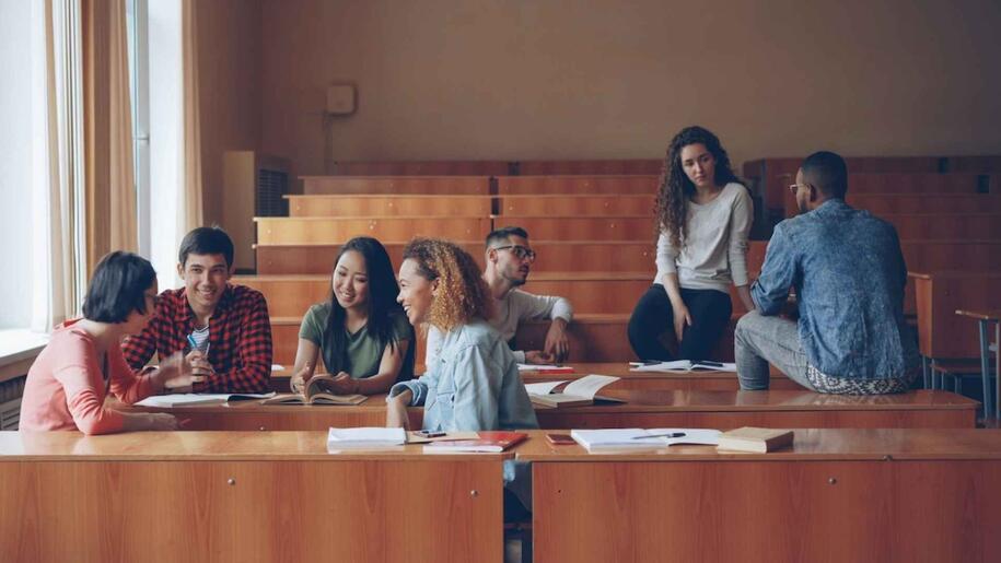Photo of students talking by Vitaly Gariev on Unsplash