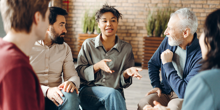 Photo of a conversation among a small diverse group