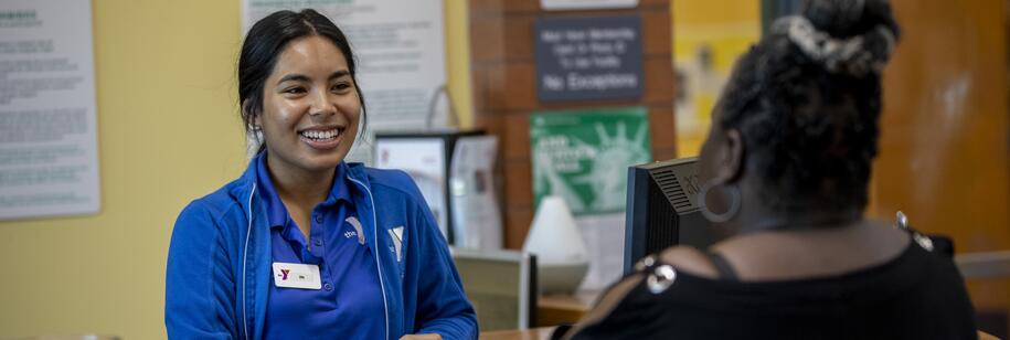 Photo of a YMCA employee smiling at a member
