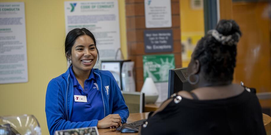 Photo of a YMCA employee smiling at a member