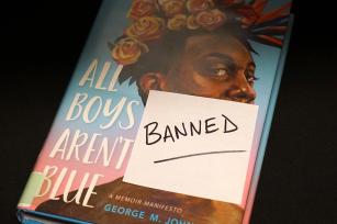 Photo of frequently banned book with post-it reading banned on the cover