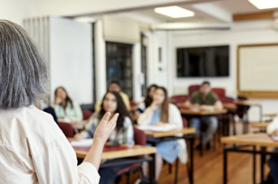 Photo: Teacher leading student discussion in classroom