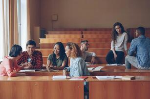 Photo of students talking by Vitaly Gariev on Unsplash