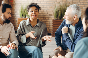 Photo of a conversation among a small diverse group